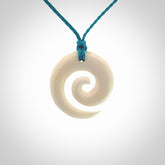 Hand carved natural bone koru pendant. Made by NZ Pacific.